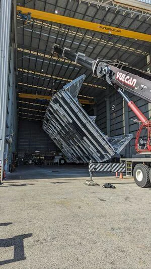 a large warehouse with a large truck aboard SILVERCAT Yacht for Sale