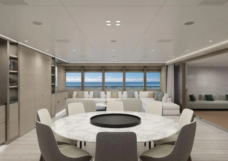a room with a table and chairs aboard SILVERCAT Yacht for Sale