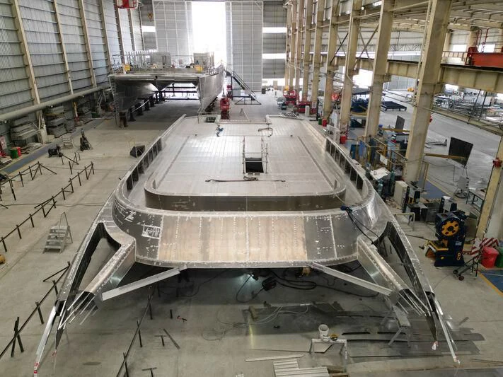 a large metal machine in a factory aboard SILVERCAT Yacht for Sale