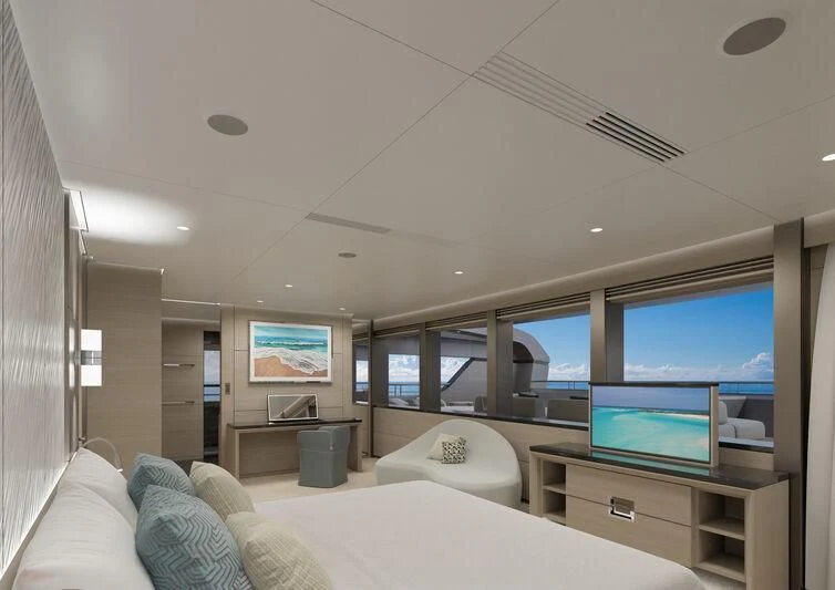 a room with a bed and a tv aboard SILVERCAT Yacht for Sale