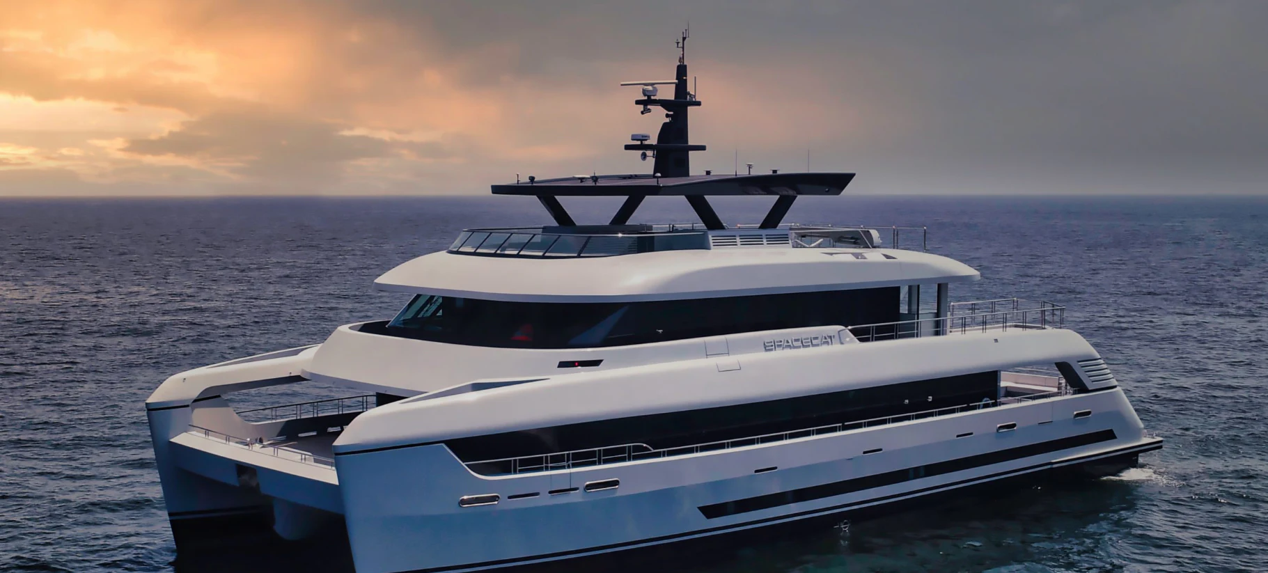 a white yacht in the water aboard SILVERCAT Yacht for Sale