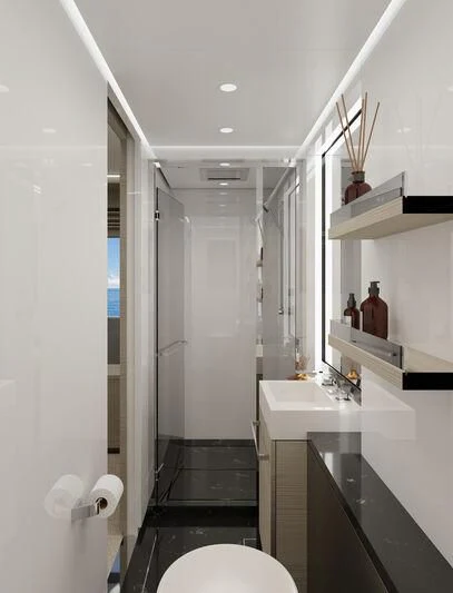 a bathroom with a sink and a toilet aboard SILVERCAT Yacht for Sale