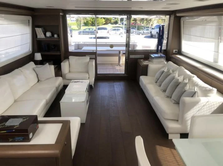 a living room with a large window aboard FERRETTI F800/27 Yacht for Sale