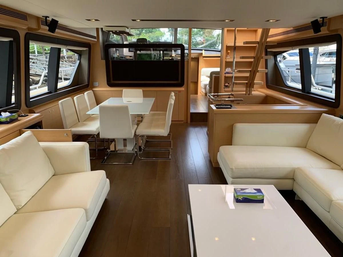 a room with couches and a tv aboard FERRETTI F800/27 Yacht for Sale