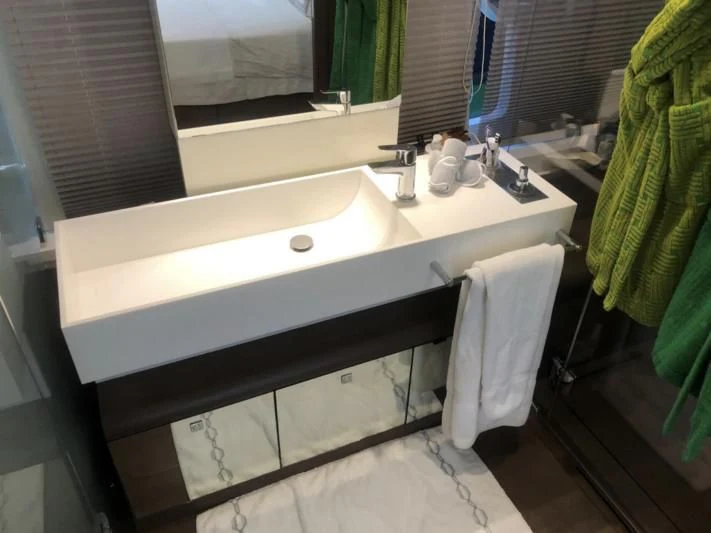 a bathroom sink with a towel on the wall aboard FERRETTI F800/27 Yacht for Sale