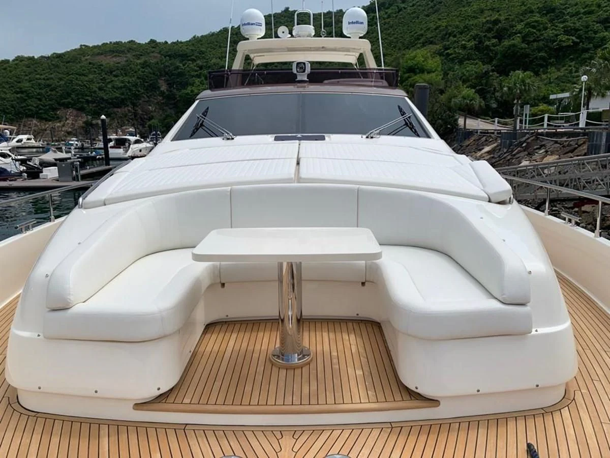 a white boat in a harbor aboard FERRETTI F800/27 Yacht for Sale
