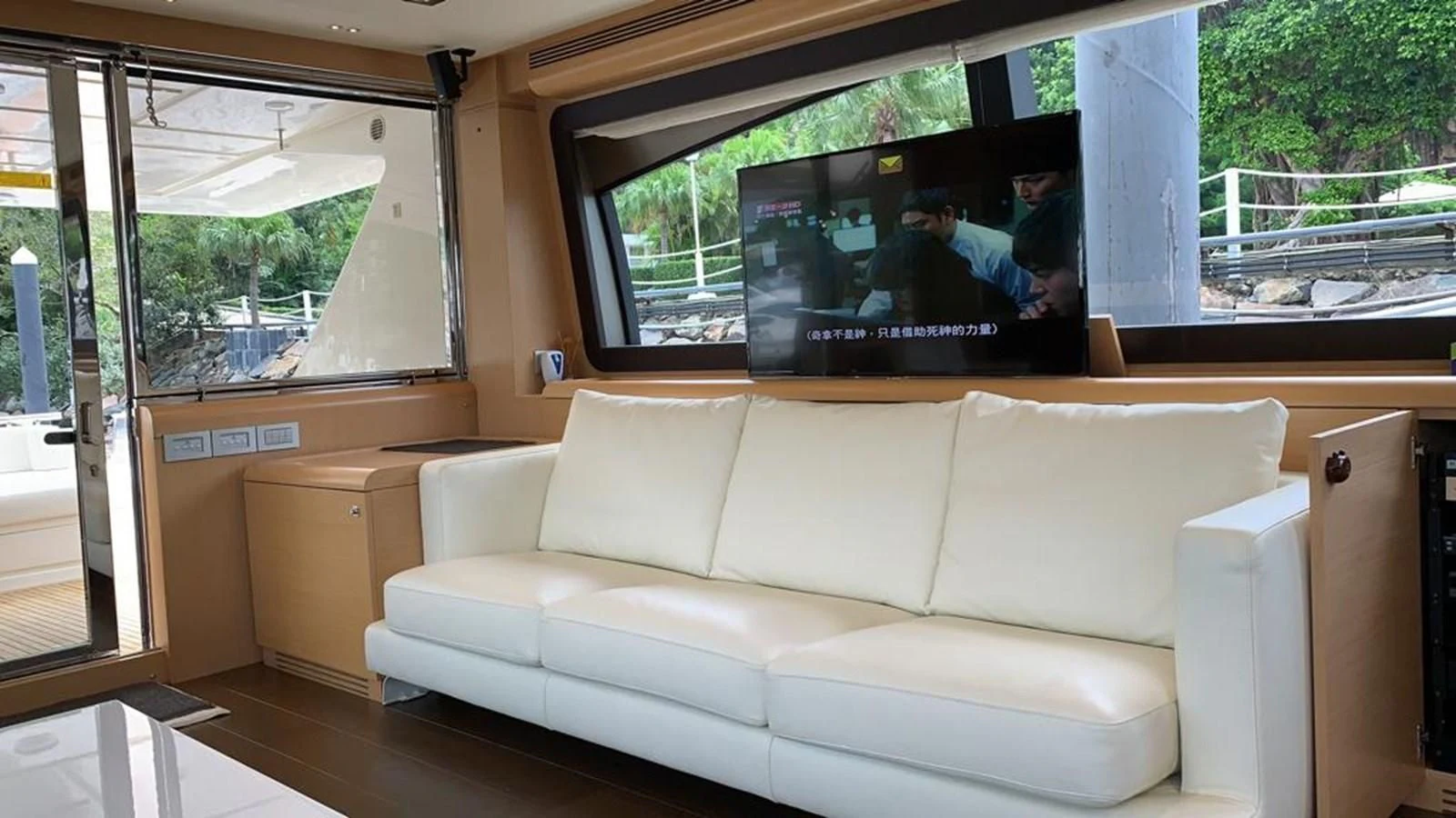 a white couch in a room aboard FERRETTI F800/27 Yacht for Sale