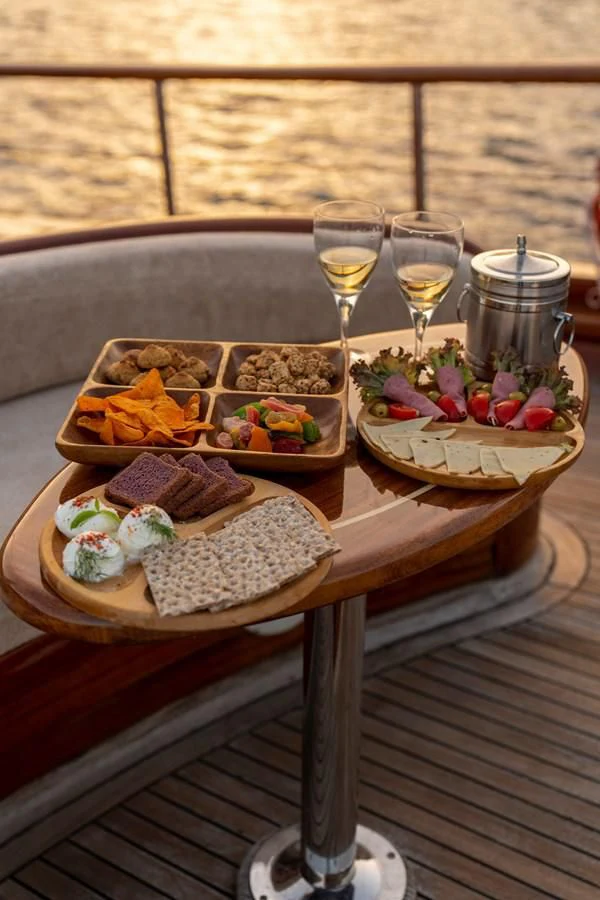 a table with food on it aboard L'ORIENT Yacht for Sale