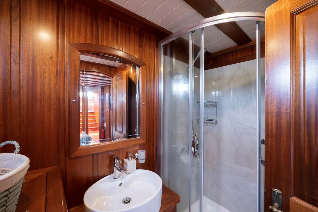 a bathroom with a shower and sink aboard L'ORIENT Yacht for Sale