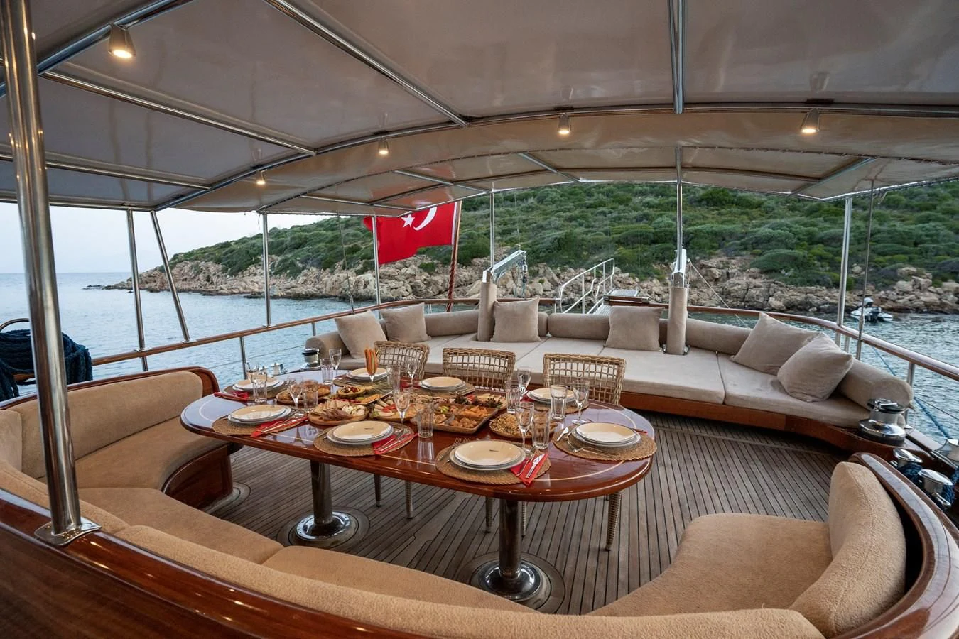 a table set for a meal aboard L'ORIENT Yacht for Sale