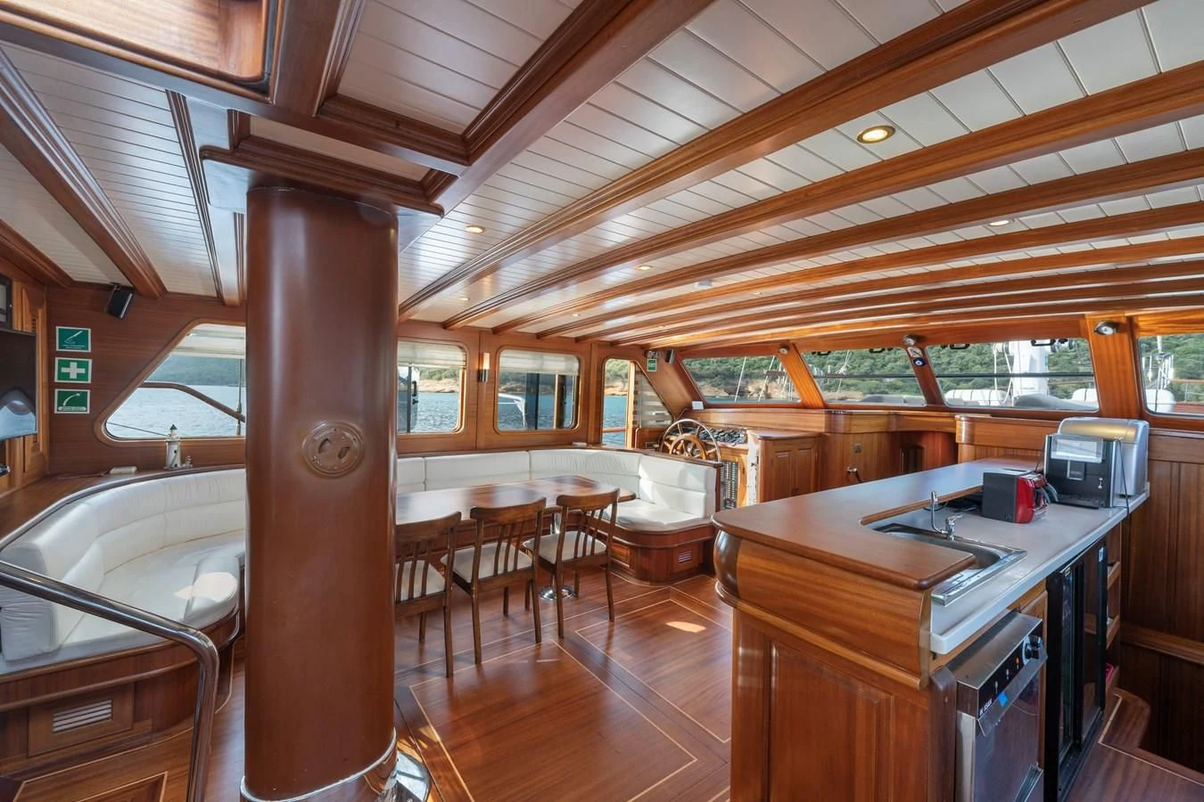 a large kitchen with wooden floors aboard L'ORIENT Yacht for Sale