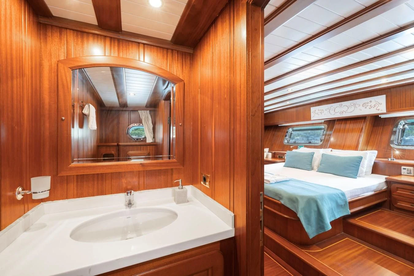 a bathroom with a bed and a mirror aboard L'ORIENT Yacht for Sale