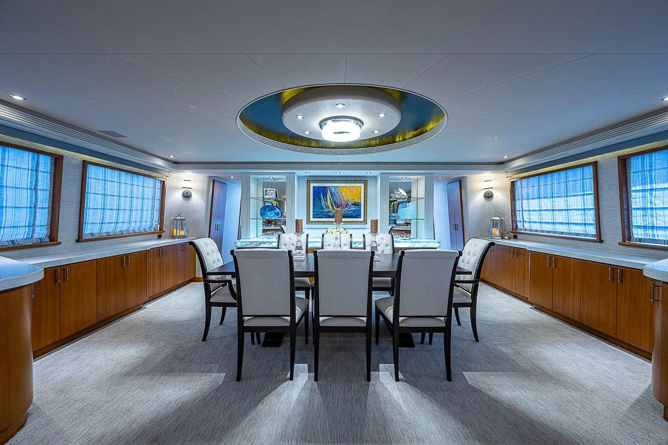 a room with a table and chairs aboard SUPERSTAR Yacht for Charter