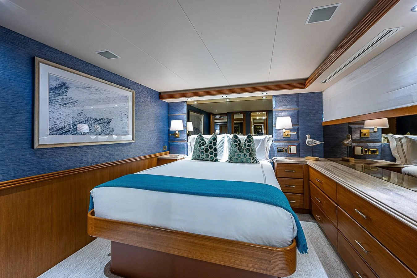 a bedroom with a bed aboard SUPERSTAR Yacht for Charter