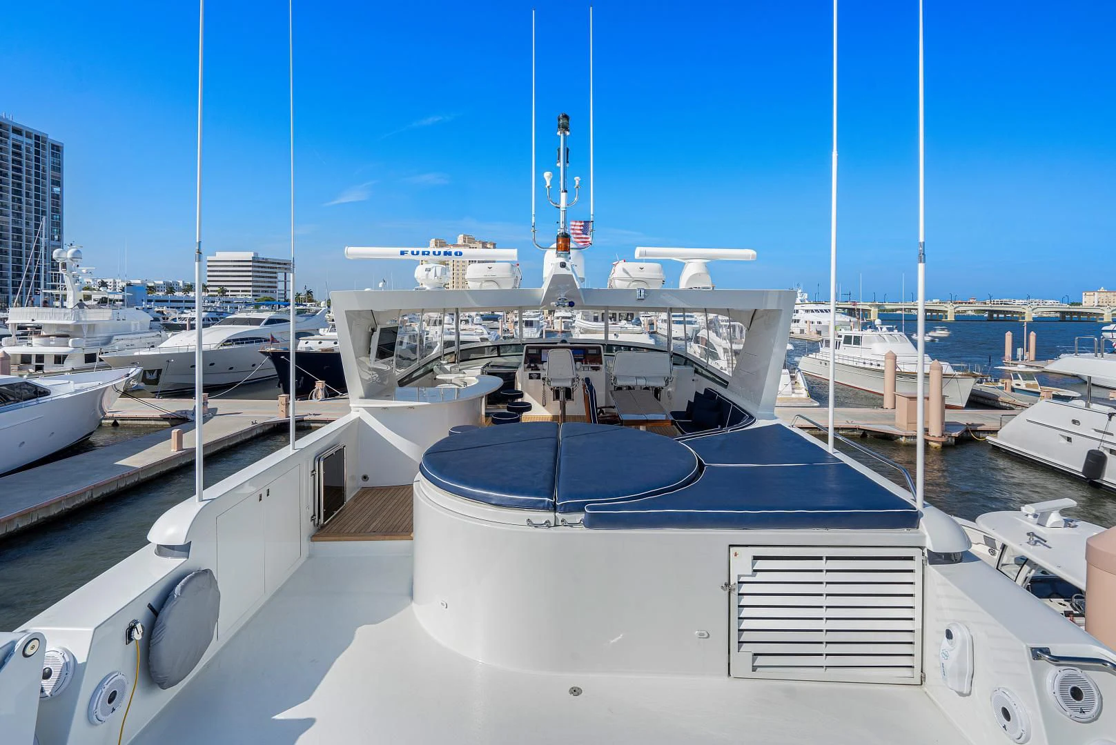 a large white boat in a harbor aboard SUPERSTAR Yacht for Charter
