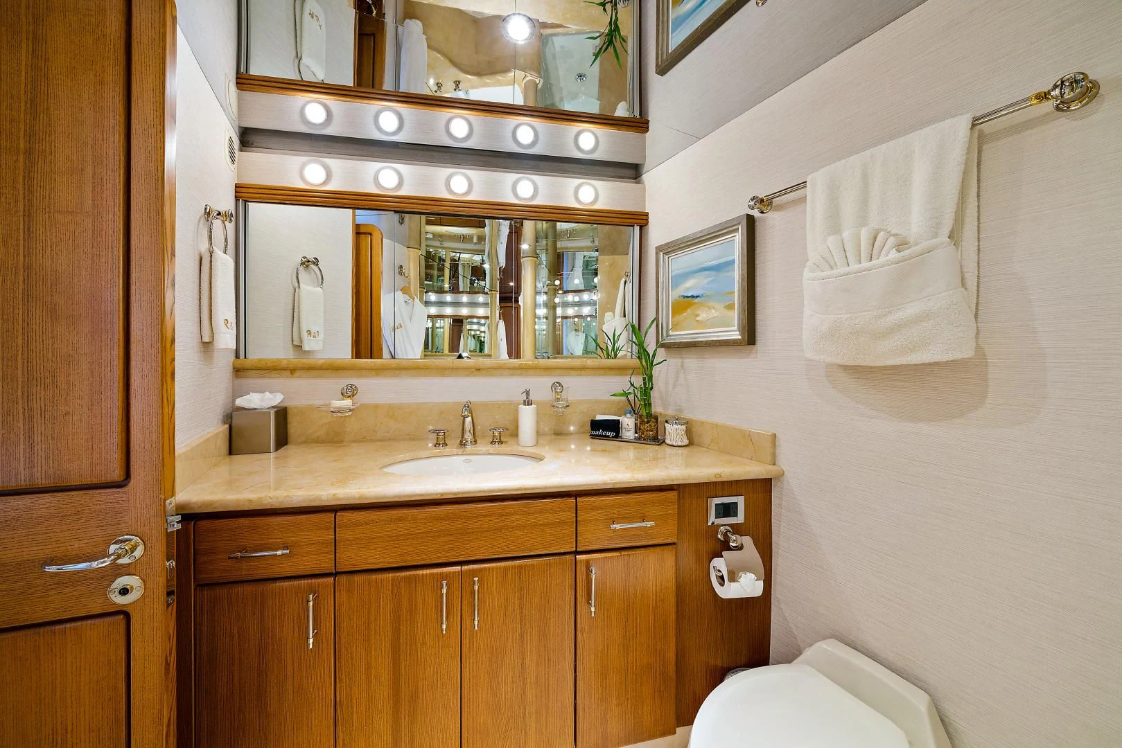 a bathroom with a sink and a mirror aboard SUPERSTAR Yacht for Charter