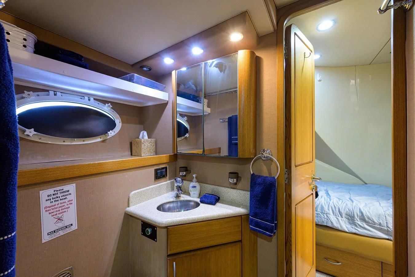 a bathroom with a sink and a mirror aboard SUPERSTAR Yacht for Charter