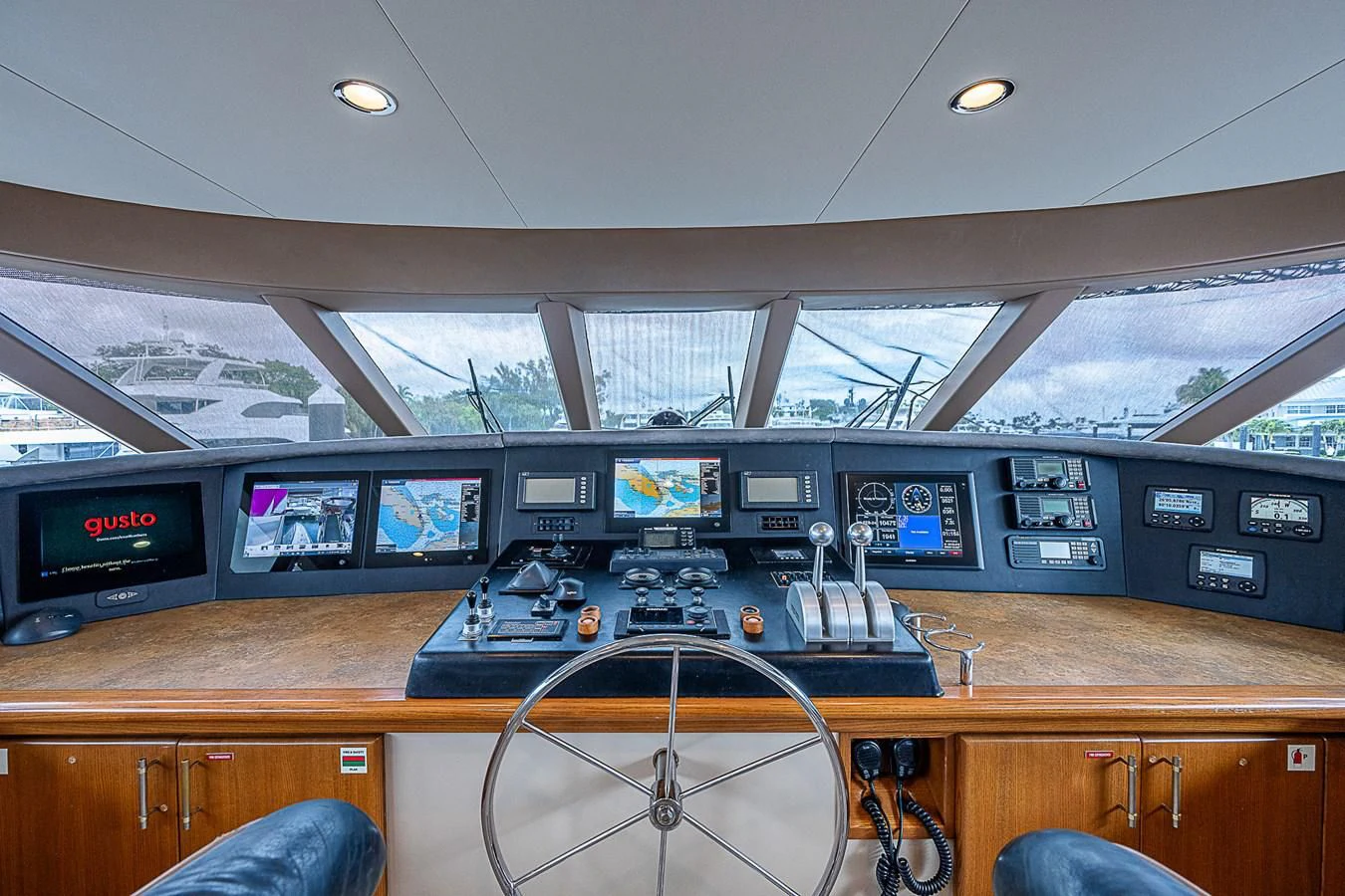 a room with many monitors and laptops on a desk aboard SUPERSTAR Yacht for Charter