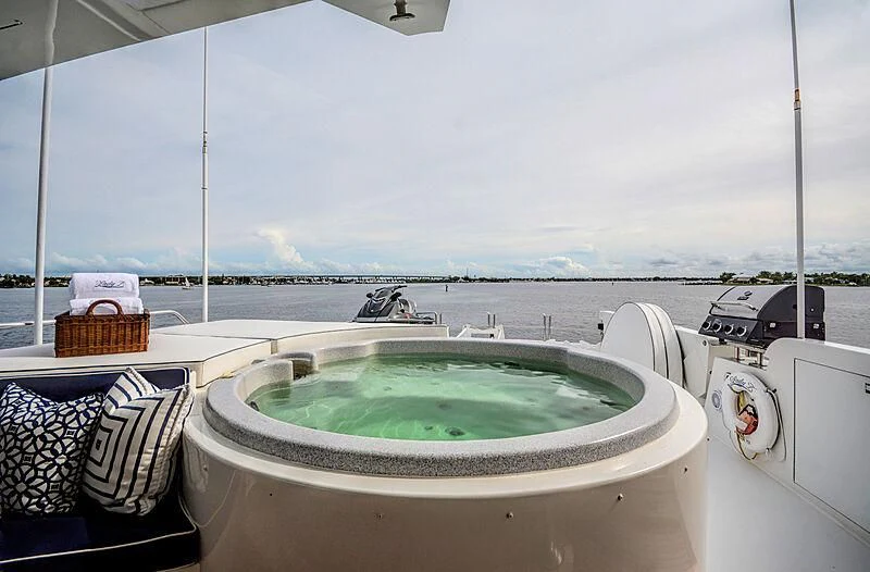 a bathtub with a sink and a sink in the background aboard SUPERSTAR Yacht for Charter