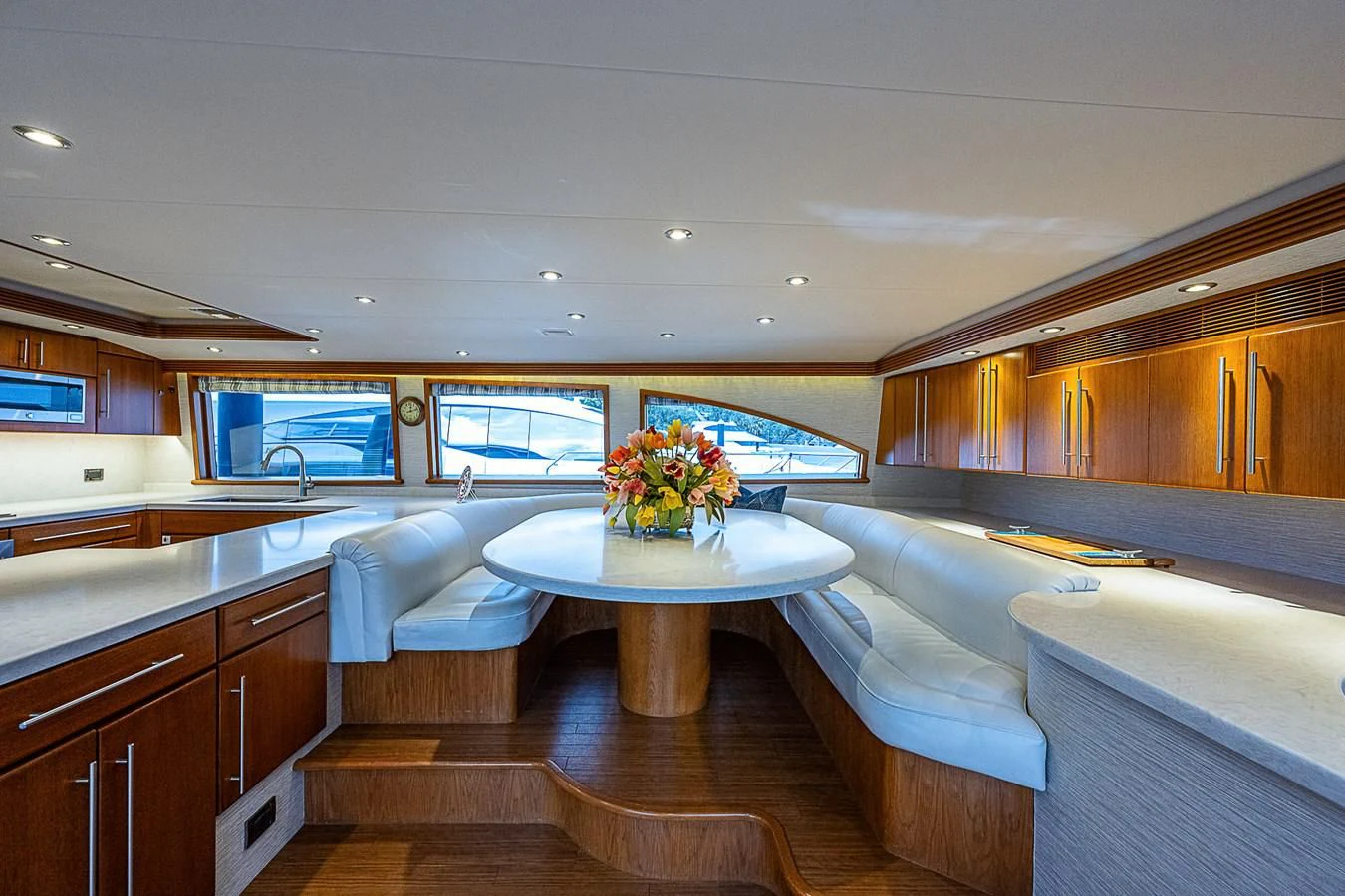 a living room with a table and couches aboard SUPERSTAR Yacht for Charter
