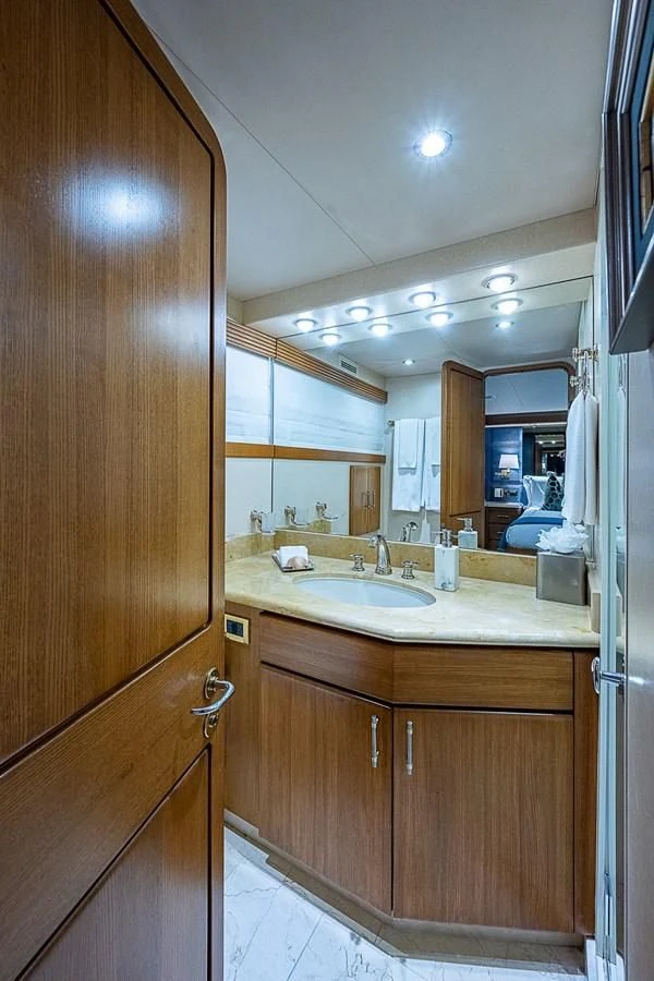 a bathroom with a sink and a mirror aboard SUPERSTAR Yacht for Charter