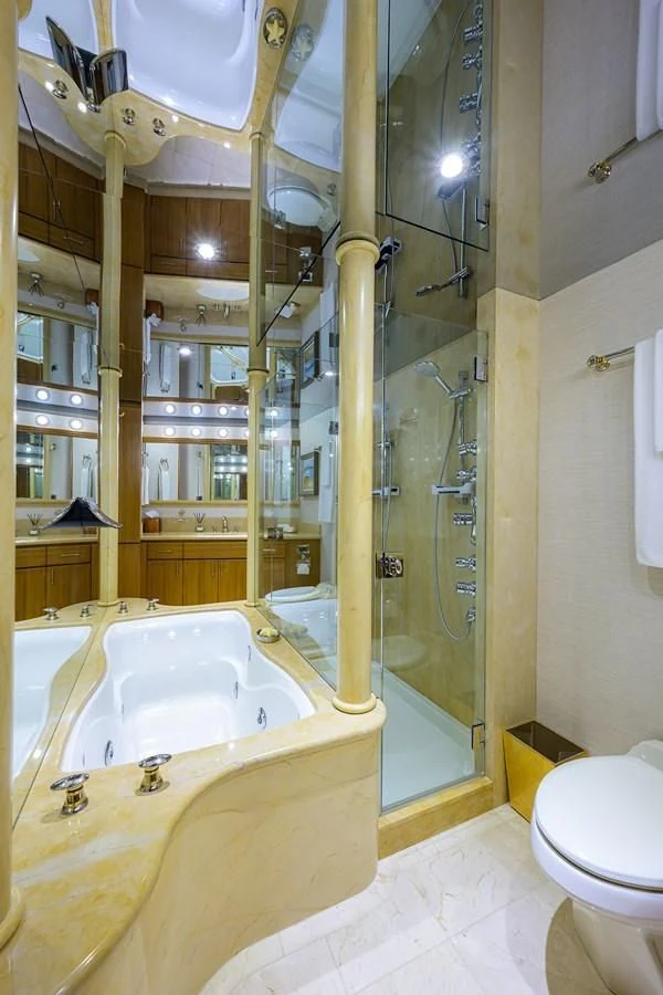 a bathroom with a glass shower aboard SUPERSTAR Yacht for Charter