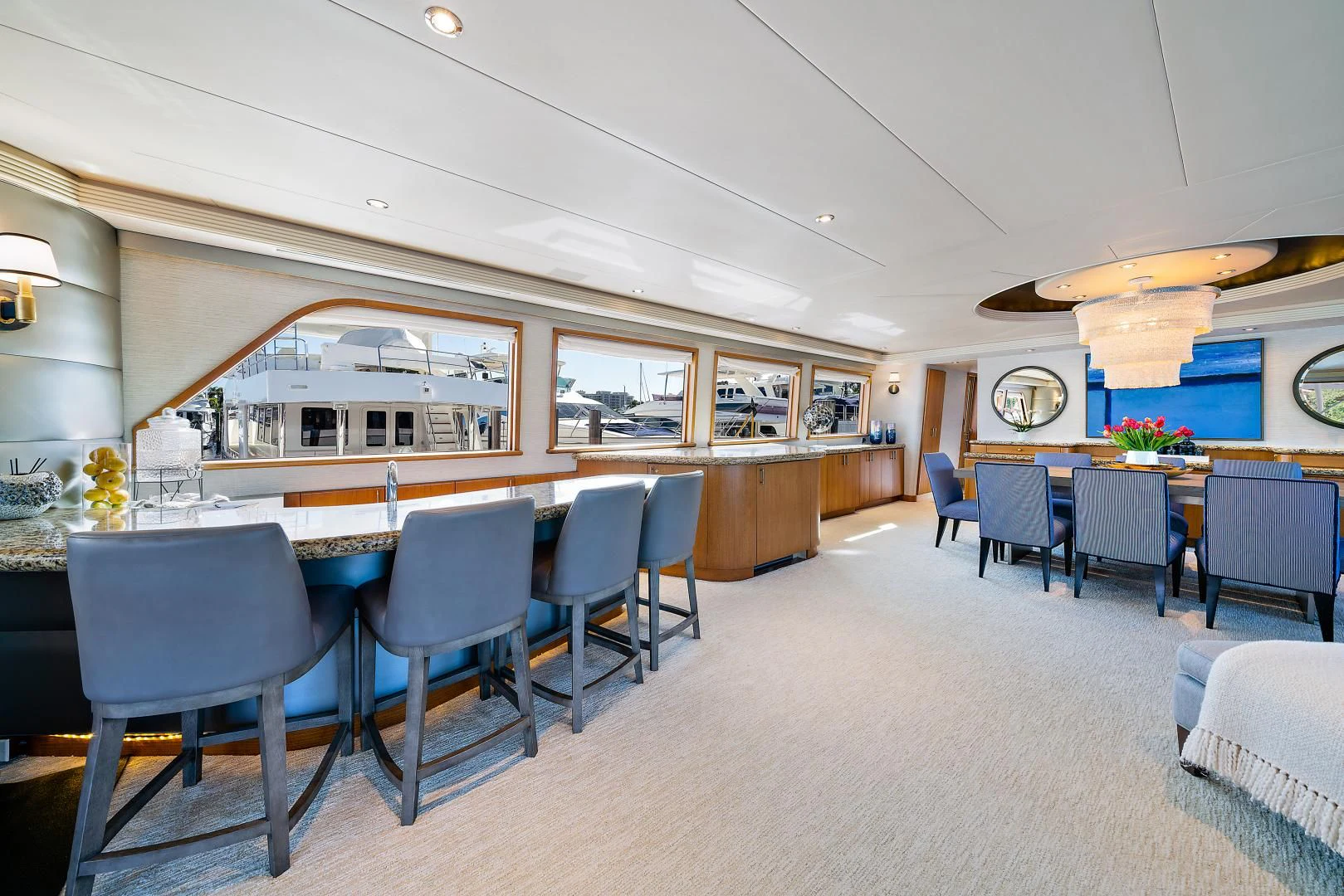 a large room with chairs and tables aboard SUPERSTAR Yacht for Charter