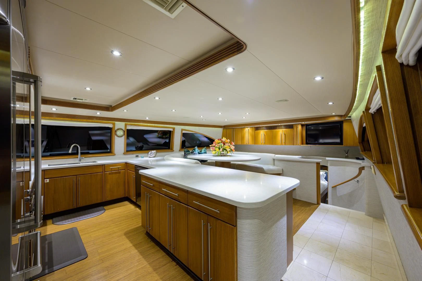 a kitchen with a large island aboard SUPERSTAR Yacht for Charter