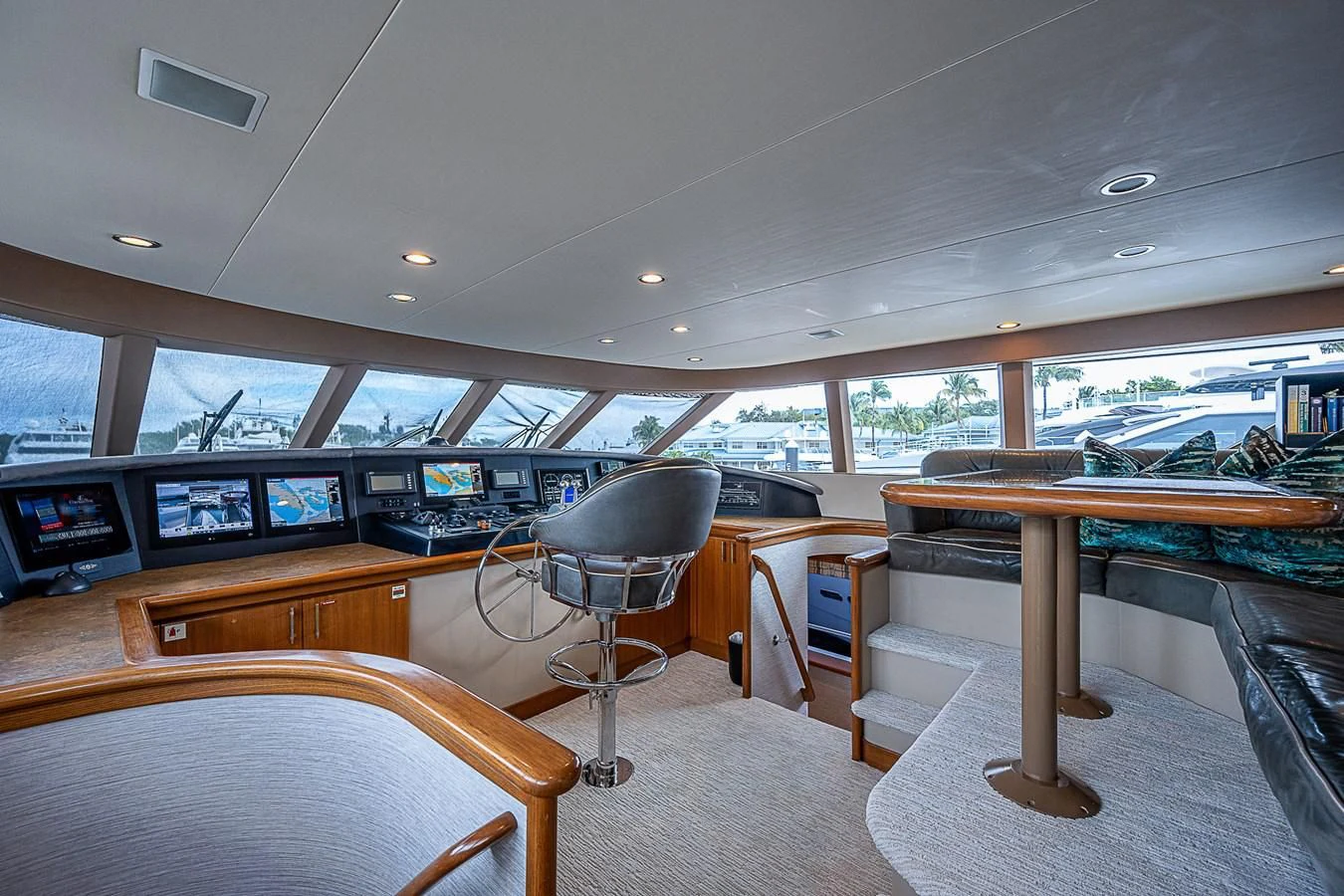 a room with a table and chairs aboard SUPERSTAR Yacht for Charter