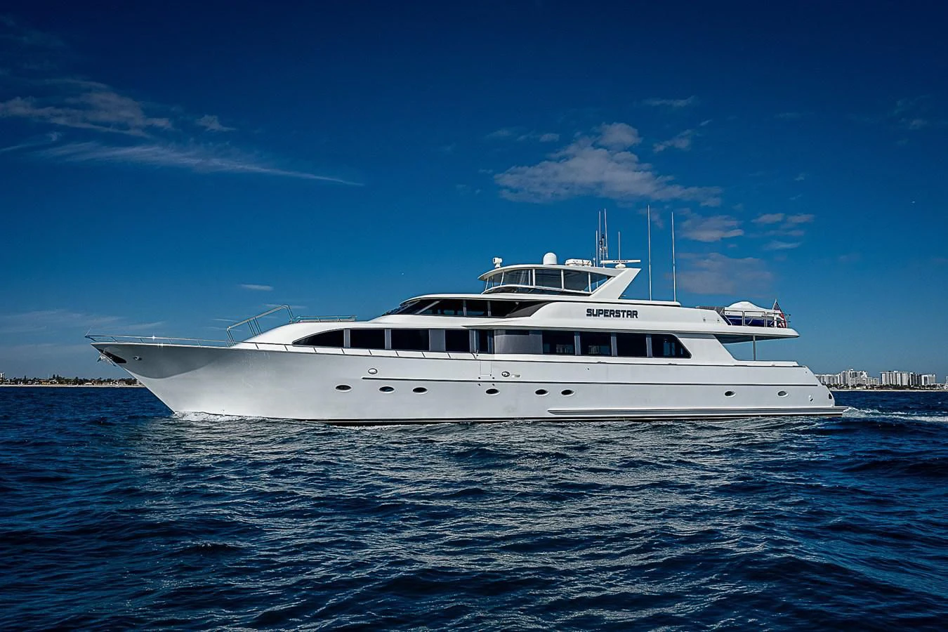 a white yacht in the water aboard SUPERSTAR Yacht for Charter
