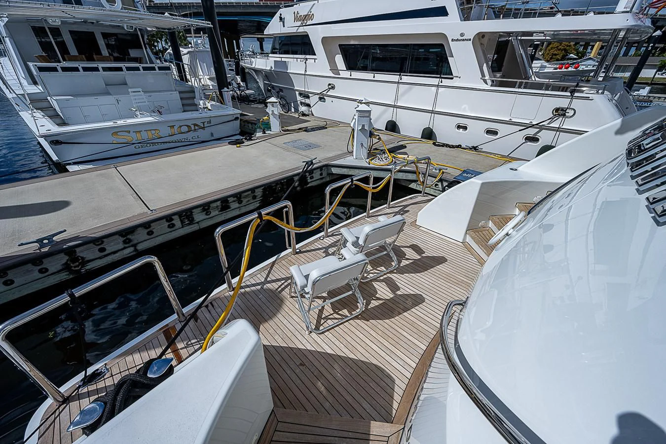 a boat docked at a pier aboard SUPERSTAR Yacht for Charter