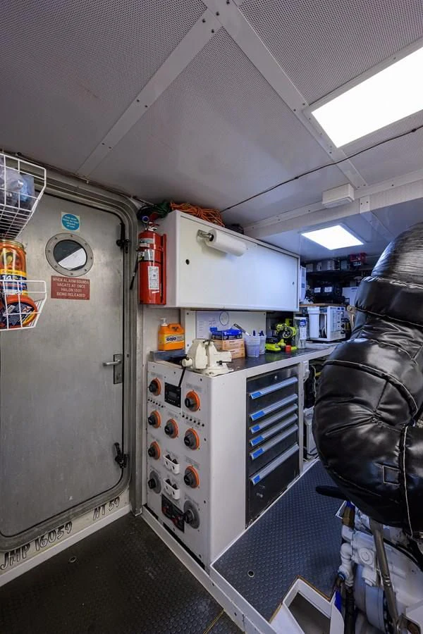 a room with a machine and a chair aboard SUPERSTAR Yacht for Charter