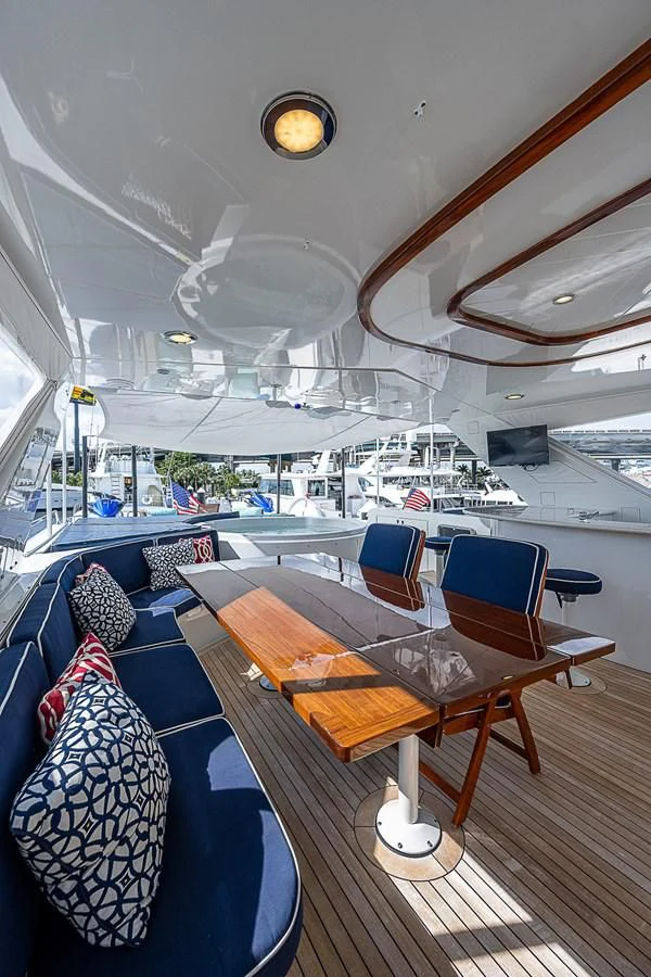 a room with a table and chairs aboard SUPERSTAR Yacht for Charter