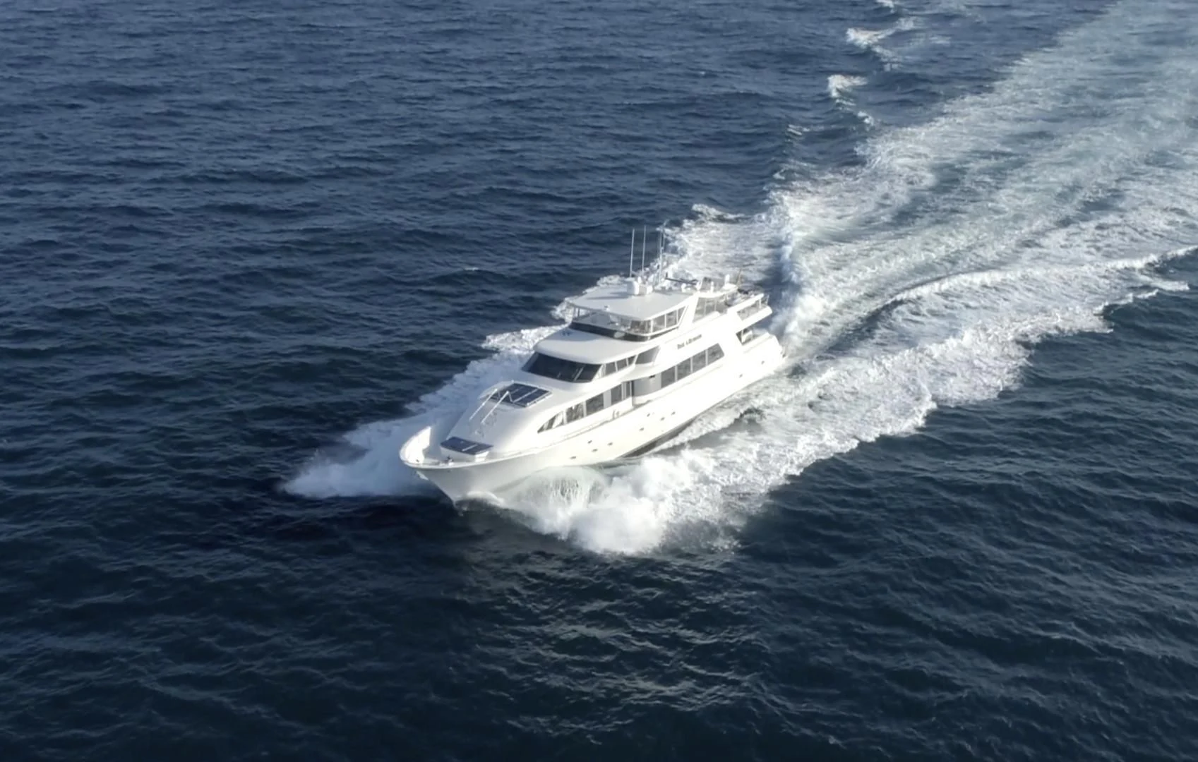 a white yacht on the water aboard SUPERSTAR Yacht for Charter