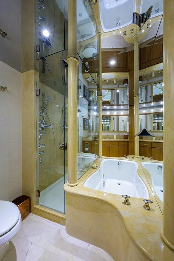 a bathroom with a large mirror aboard SUPERSTAR Yacht for Charter