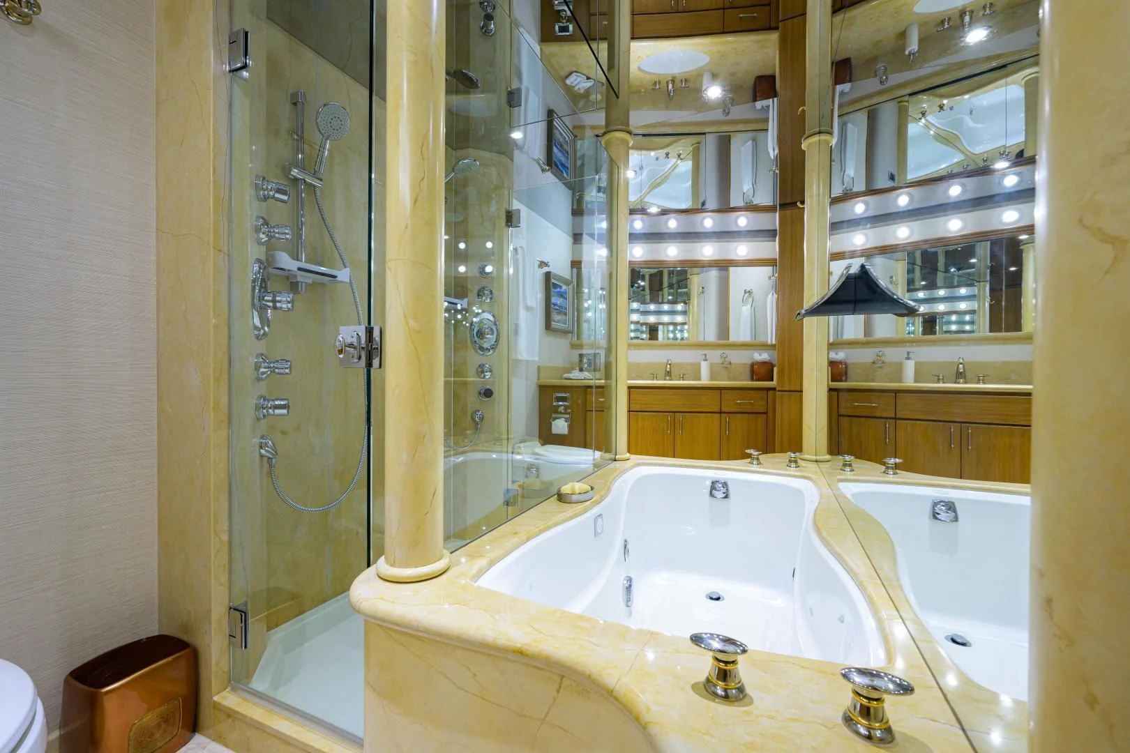 a bathroom with a bathtub and shower aboard SUPERSTAR Yacht for Charter