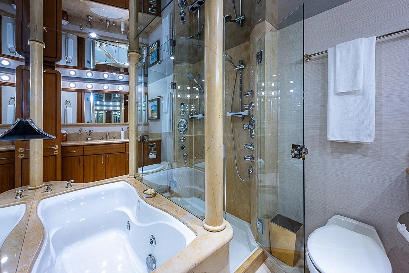 a bathroom with a glass shower aboard SUPERSTAR Yacht for Charter