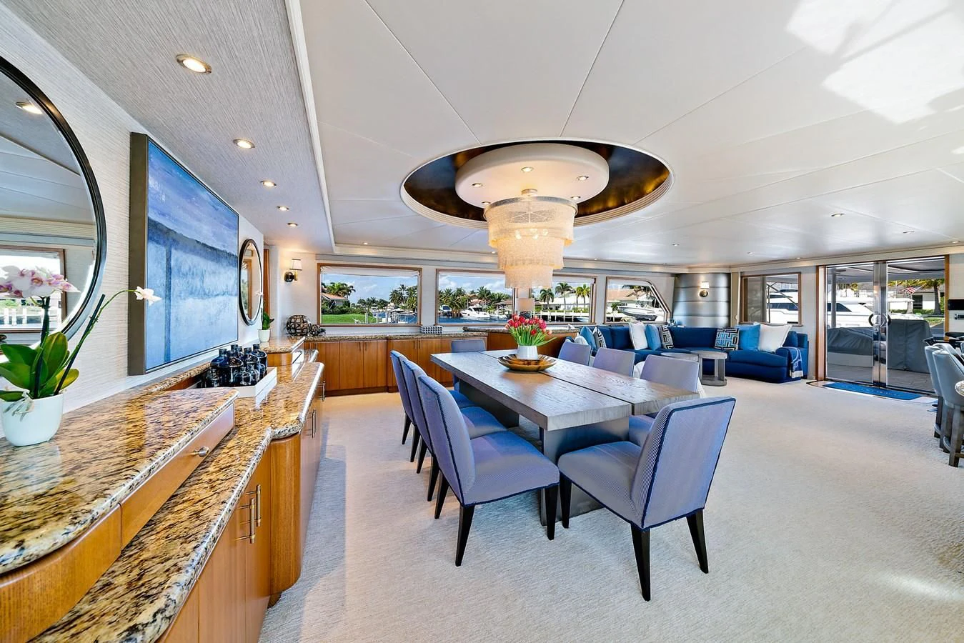 a large room with a table and chairs aboard SUPERSTAR Yacht for Charter