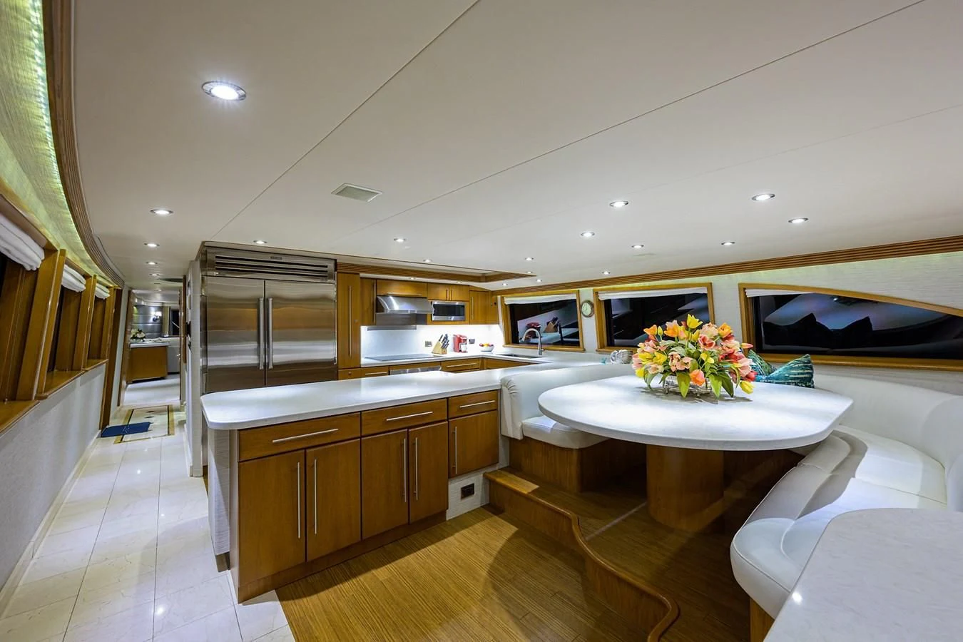 a room with a table and chairs aboard SUPERSTAR Yacht for Charter