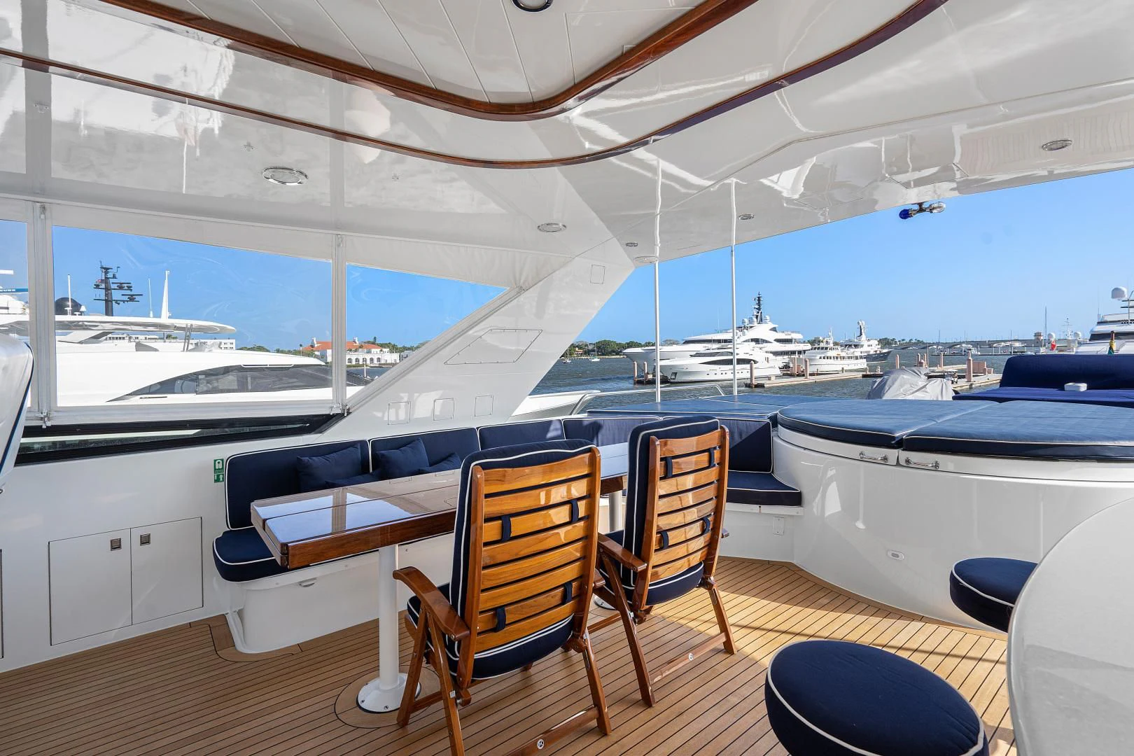 a boat deck with chairs and tables aboard SUPERSTAR Yacht for Charter