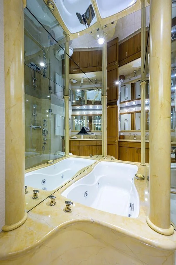 a bathroom with a large mirror aboard SUPERSTAR Yacht for Charter