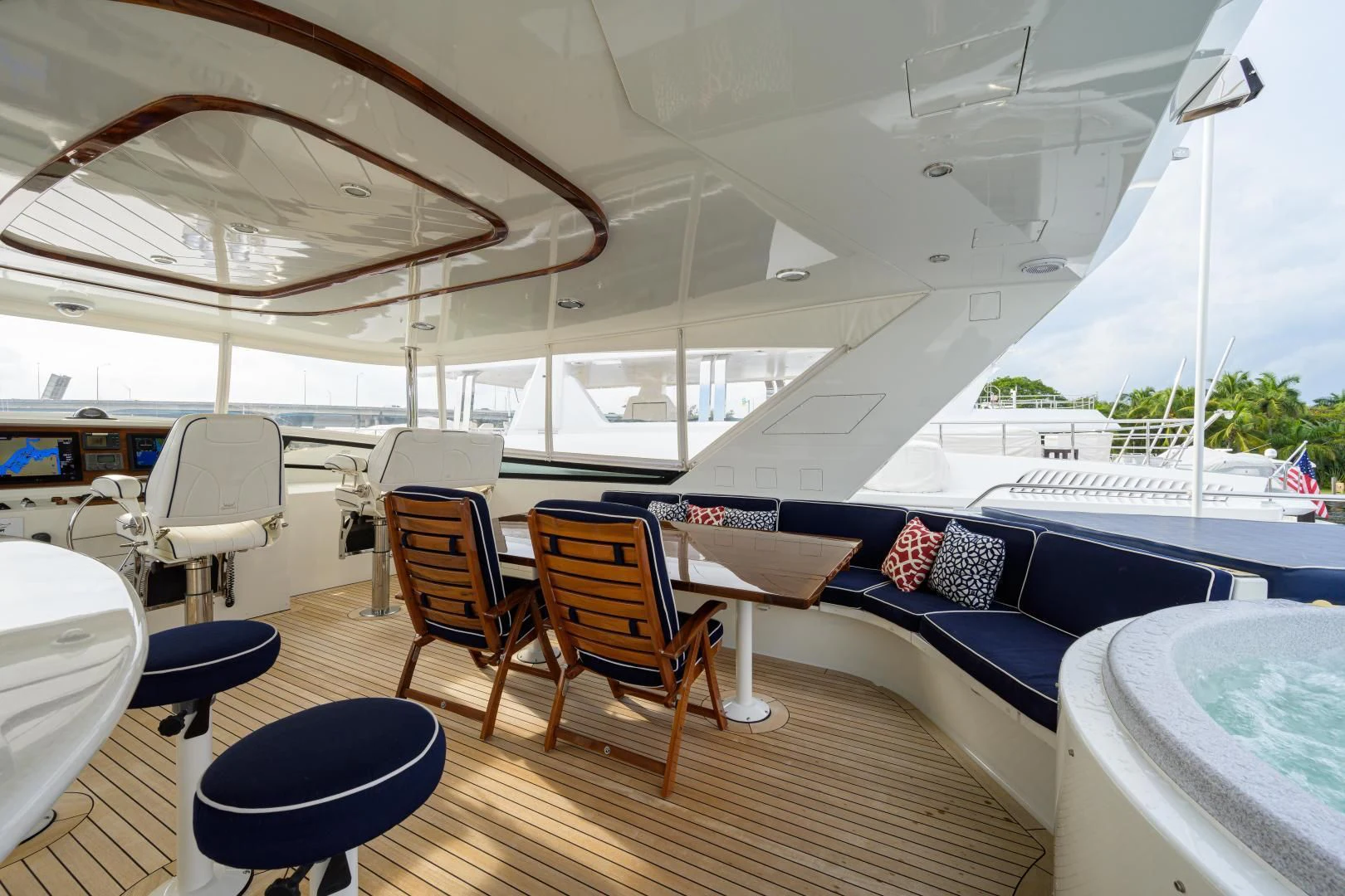 a room with a large white boat and chairs aboard SUPERSTAR Yacht for Charter