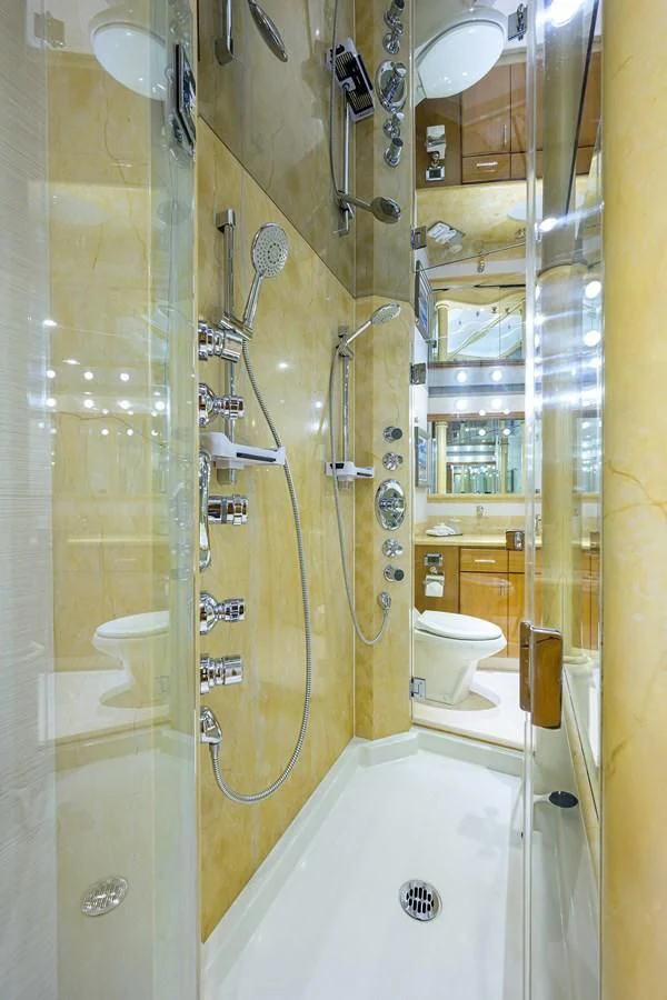 a bathroom with a shower and toilet aboard SUPERSTAR Yacht for Charter