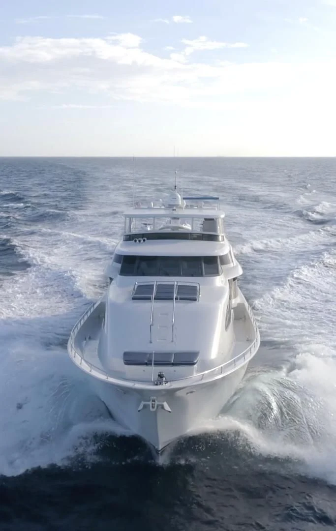 a white boat in the water aboard SUPERSTAR Yacht for Charter