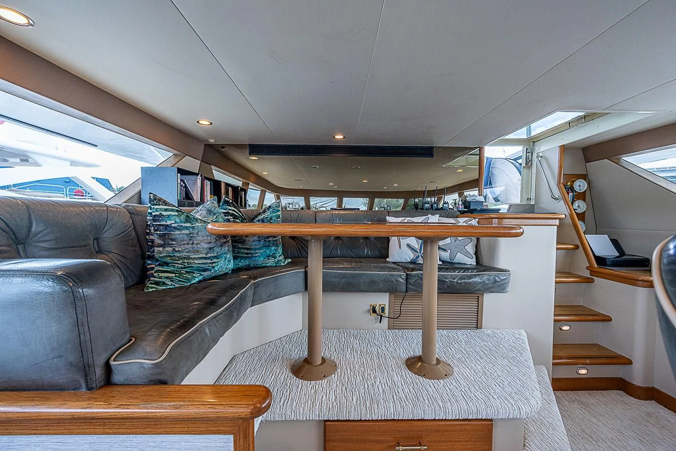a living room with a couch and a table aboard SUPERSTAR Yacht for Charter