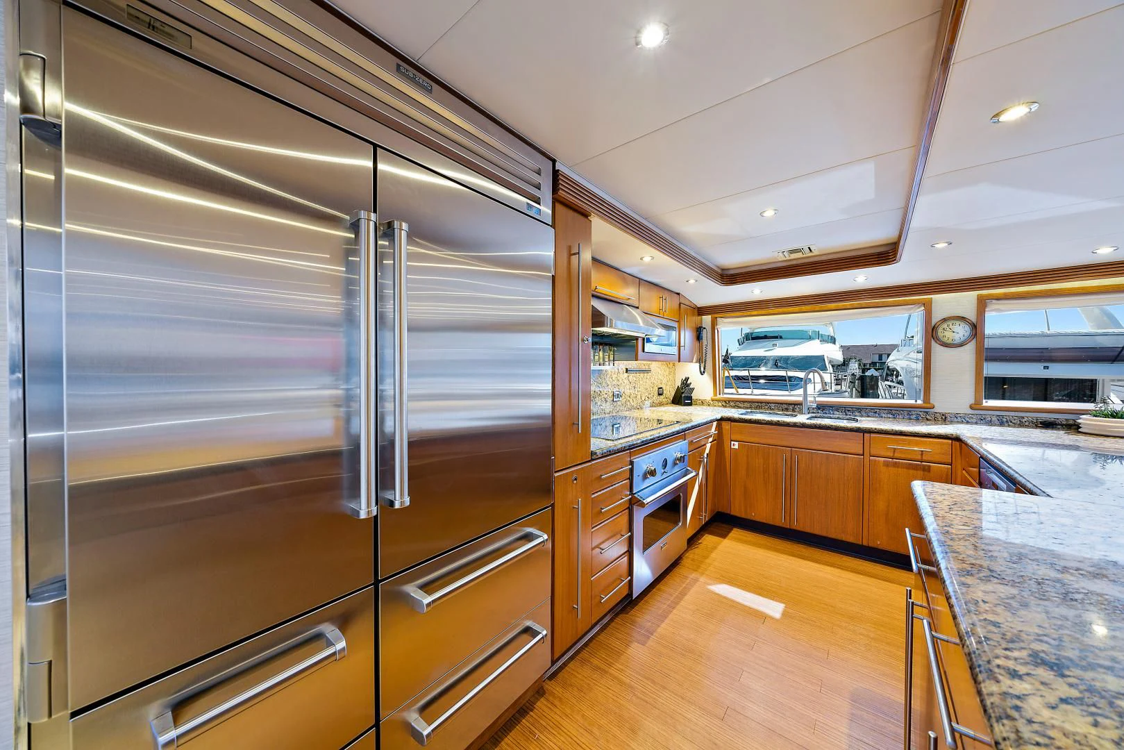 a large kitchen with stainless steel appliances aboard SUPERSTAR Yacht for Charter