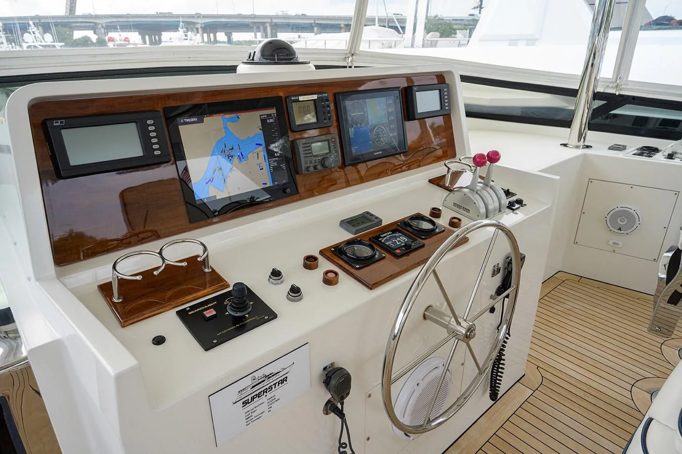 a room with a large television and a fan aboard SUPERSTAR Yacht for Charter