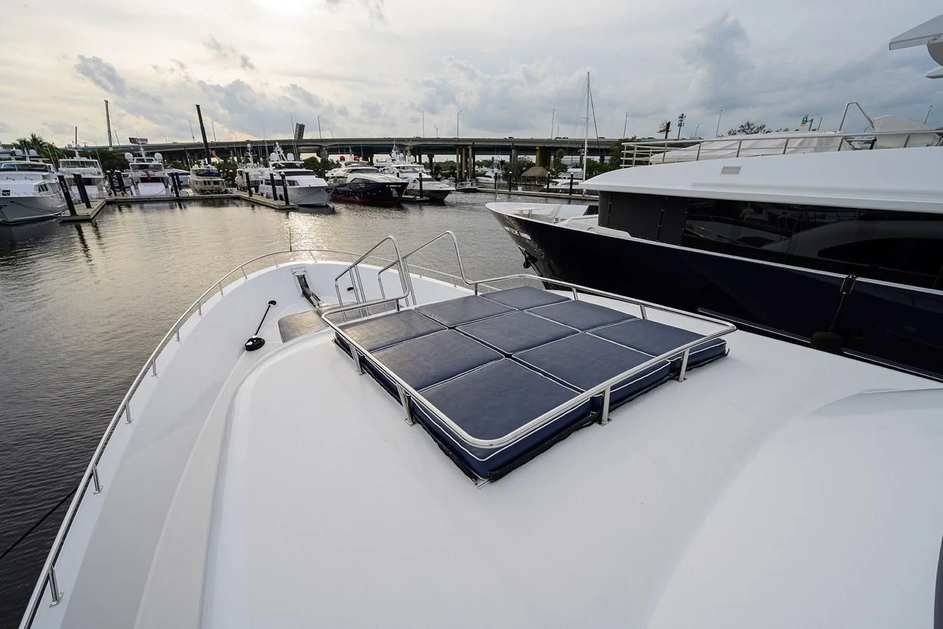 a boat is parked on the side of a river aboard SUPERSTAR Yacht for Charter