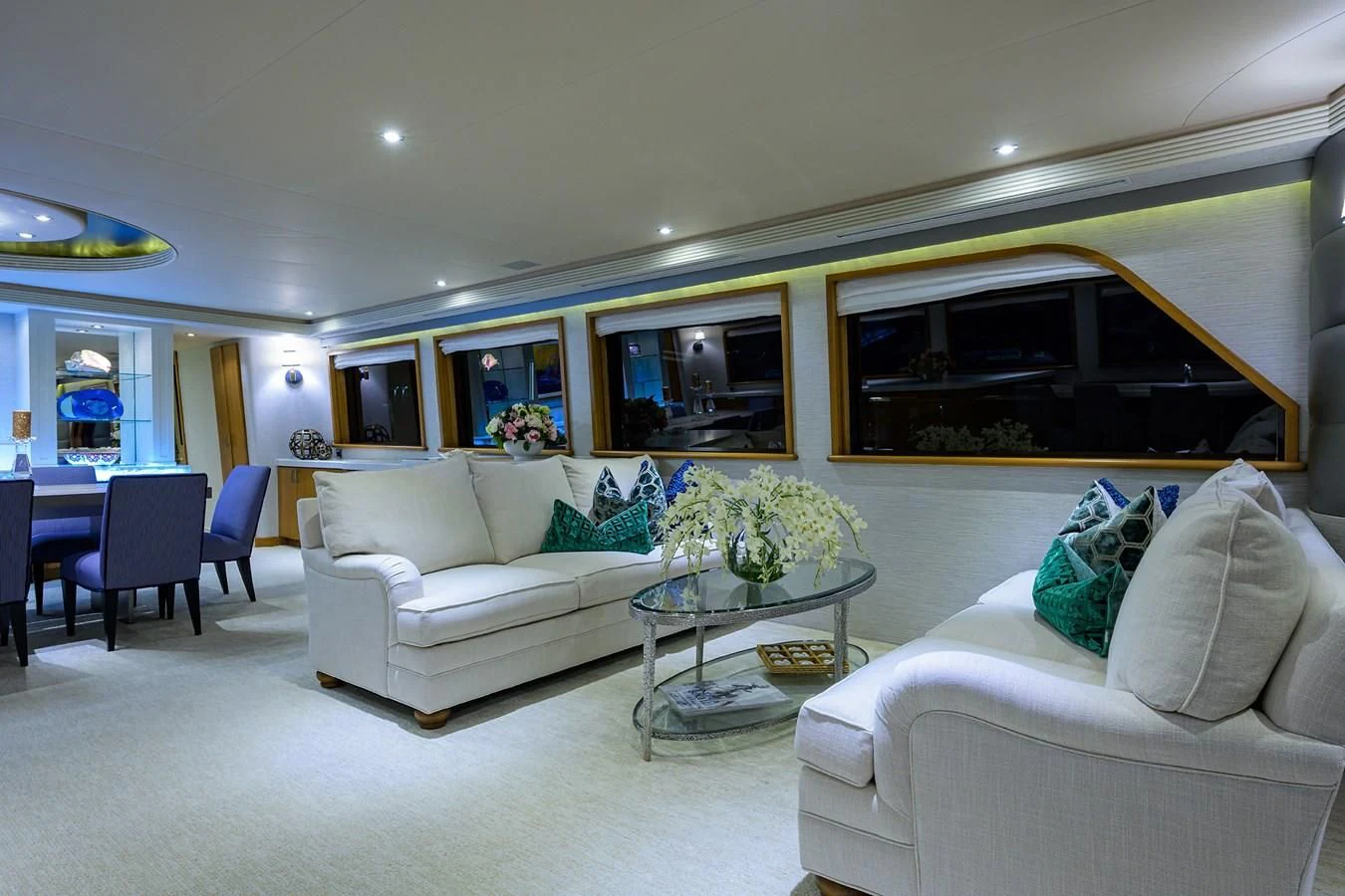 a living room with a white couch and a table aboard SUPERSTAR Yacht for Charter