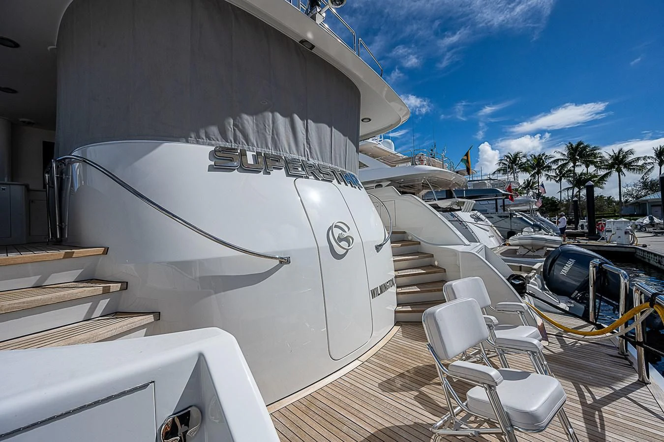 a boat docked at a pier aboard SUPERSTAR Yacht for Charter